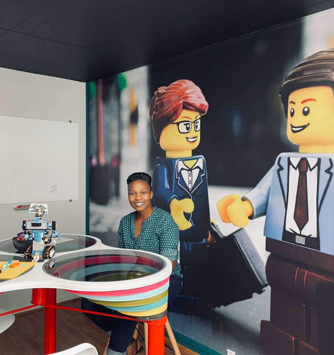 Team member in office space with Lego