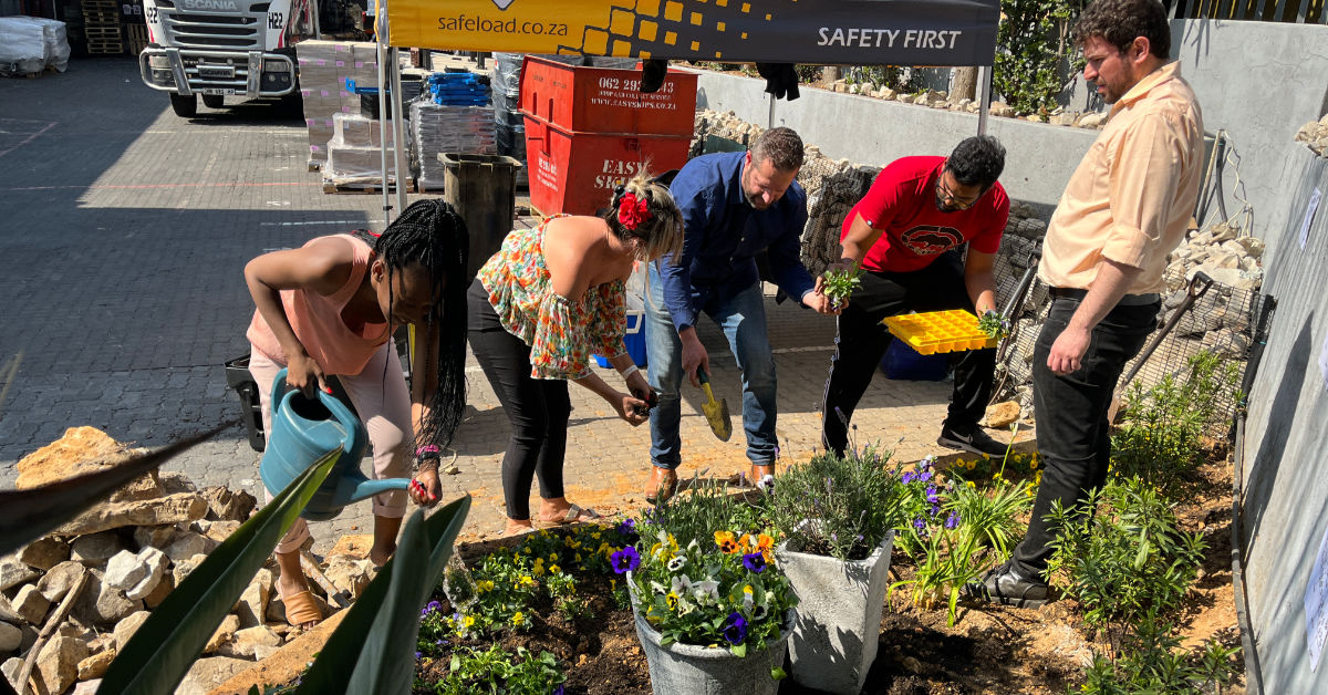 group of people Planting flowers