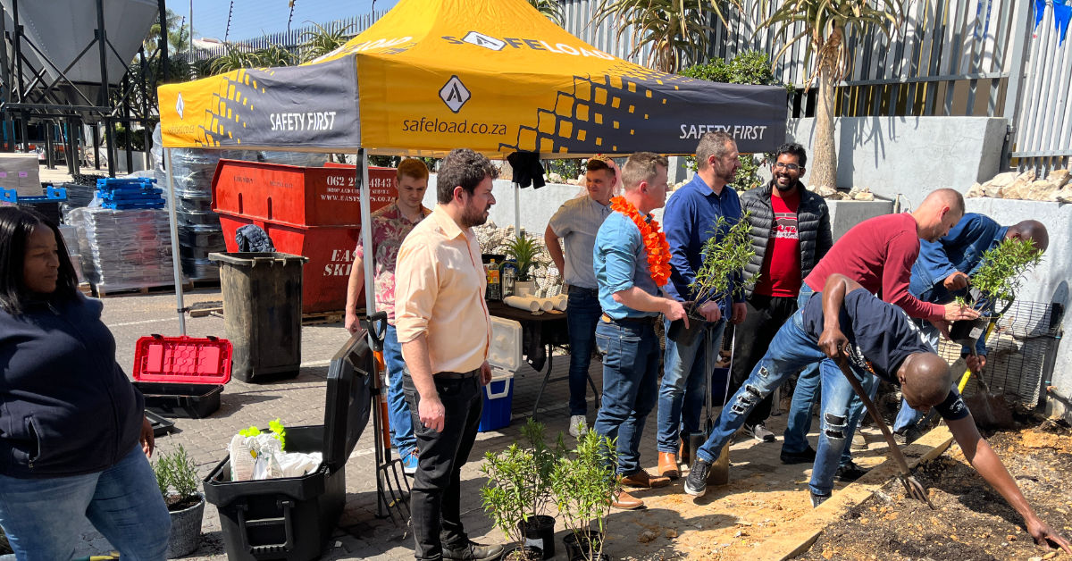 Group of people planting flowers