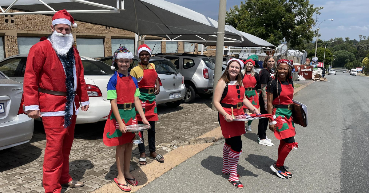 Employees dressed up in christmas outfits